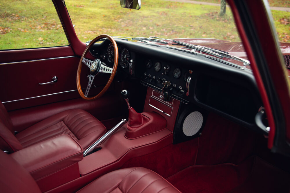 Vintage car interior with red leather seats and dashboard