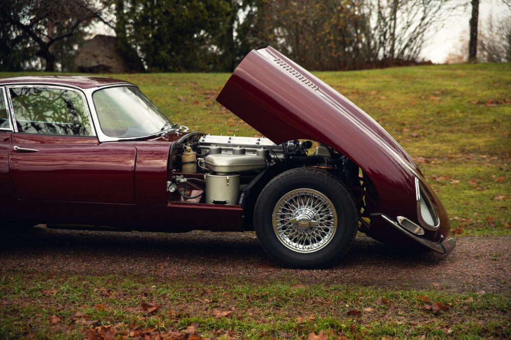 Vintage car with open hood showing engine