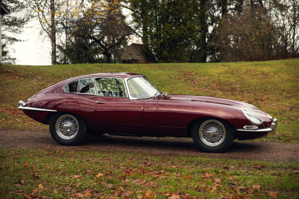 Vintage burgundy sports car parked outdoors