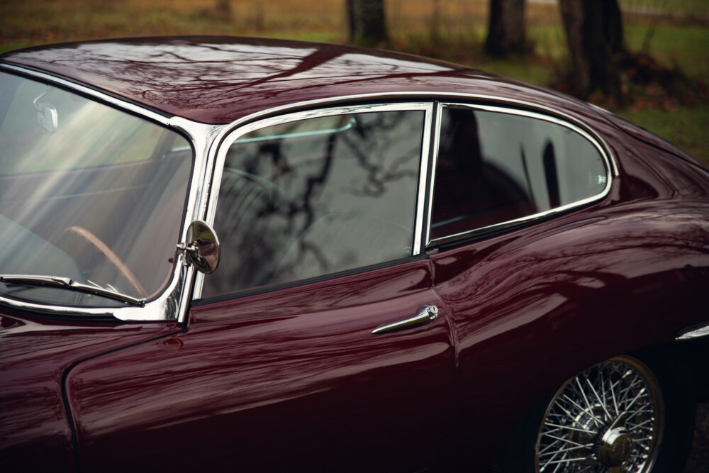 Vintage burgundy car with shiny chrome detailing