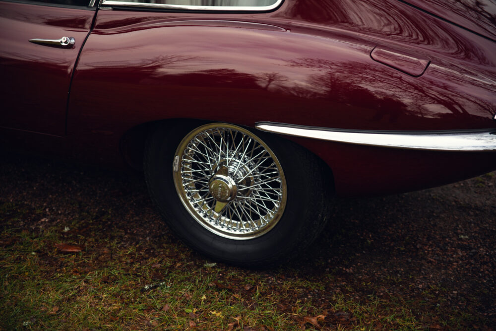 Vintage red car with detailed chrome wire wheel