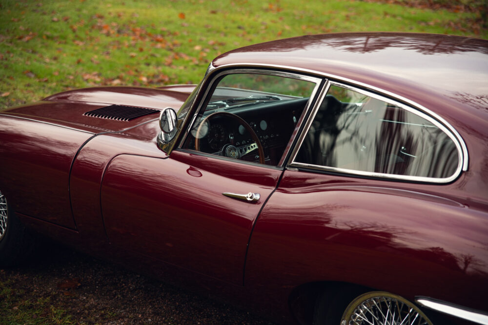 Vintage maroon sports car with elegant design details