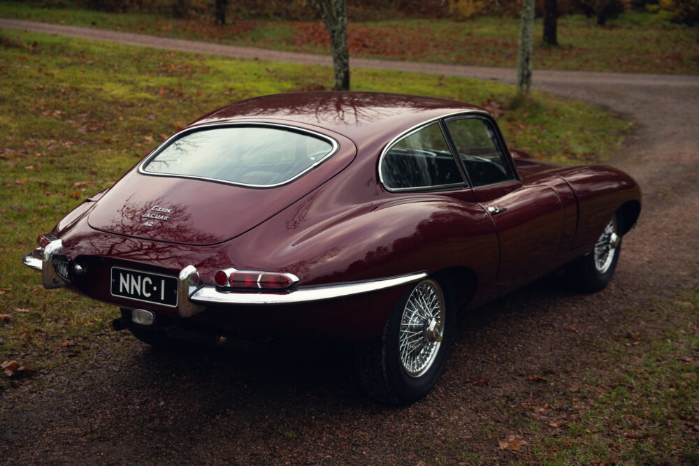 Vintage Jaguar E-Type car on a forest road