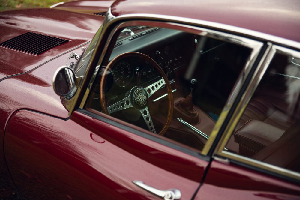 Classic car interior, wooden steering, luxury dashboard