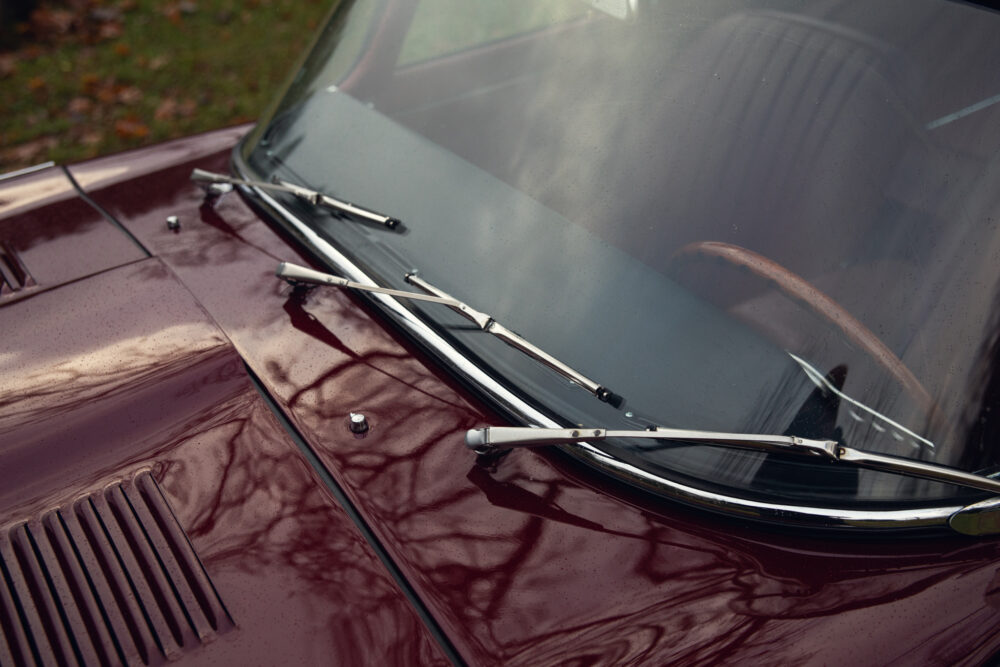 Close-up of vintage car windshield and wipers