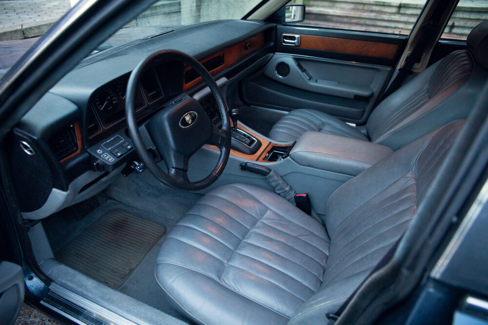 Vintage car interior with leather seats and wooden accents