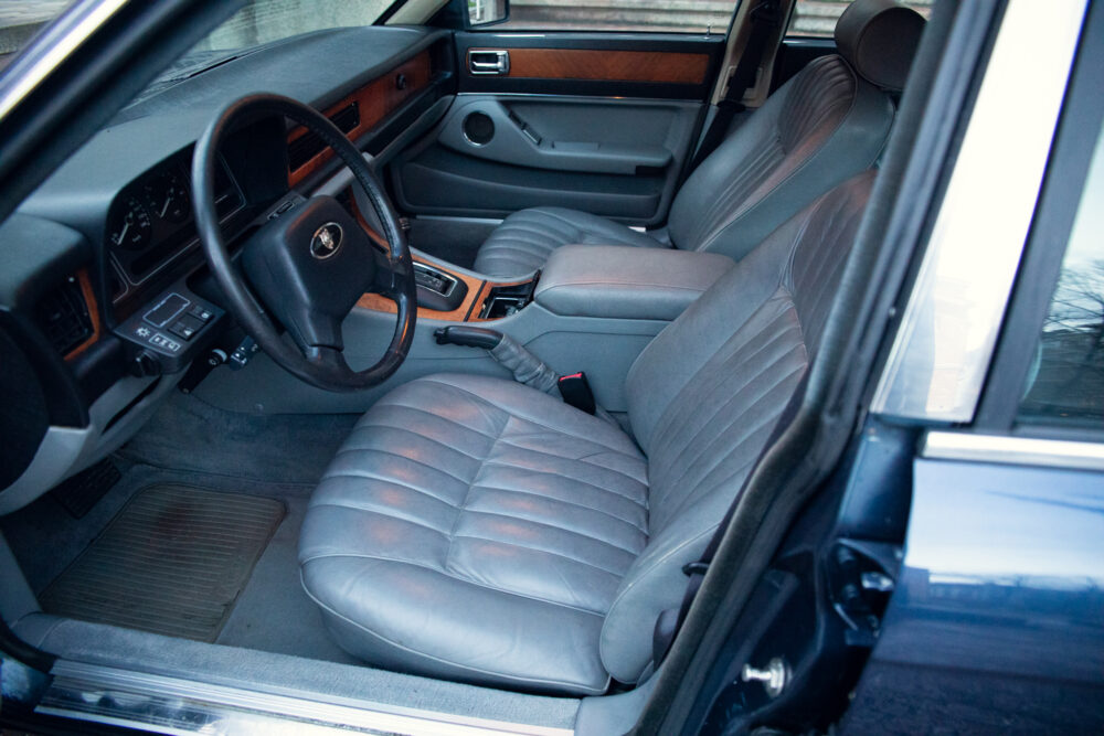 Vintage car interior with leather seats and wooden accents