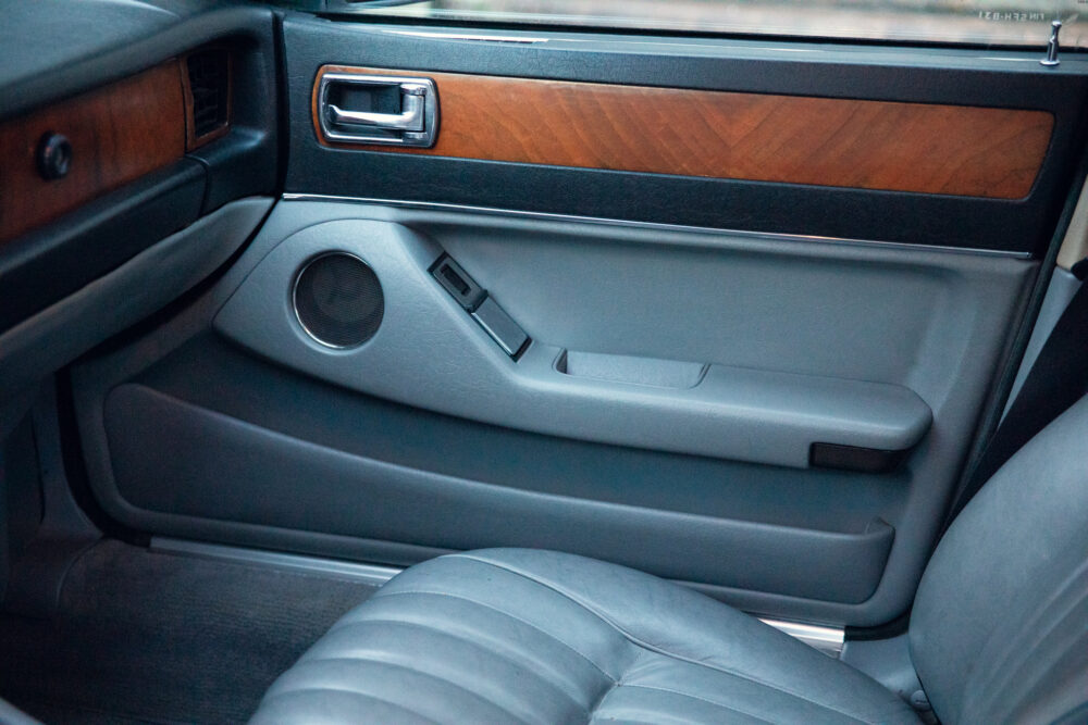 Classic car interior with wooden trim and leather seat