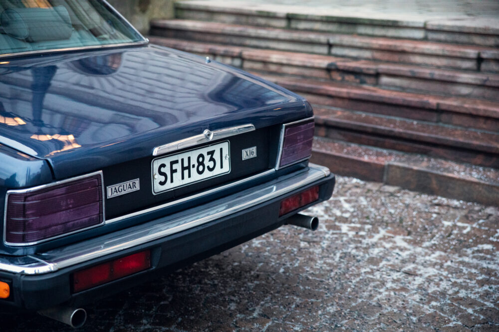 Rear view of a dark blue Jaguar XJ6 car