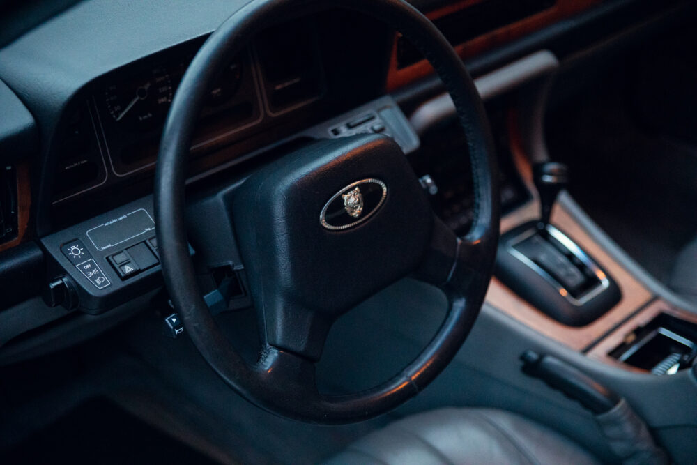Close-up of car steering wheel and dashboard