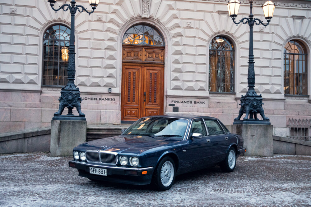 Vintage car outside Finland's Bank in snowy setting