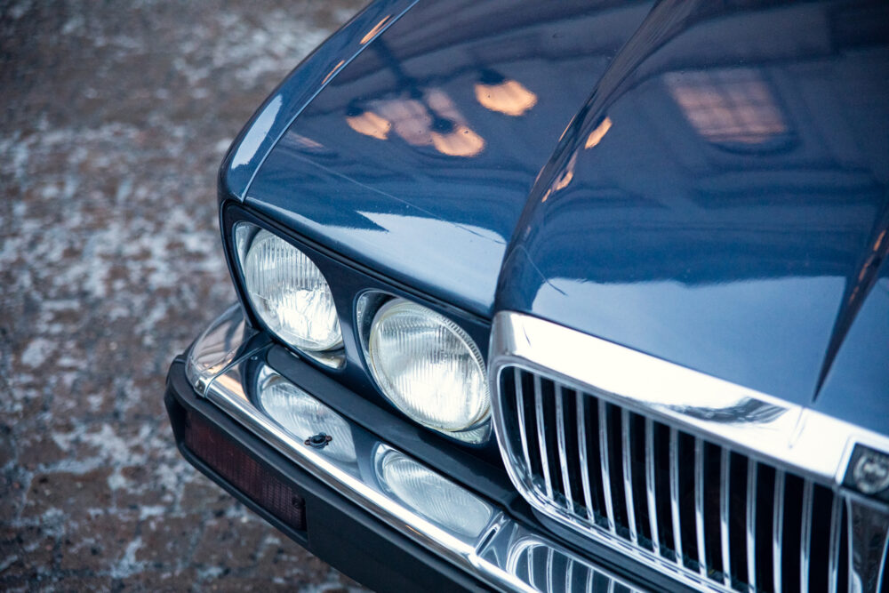 Close-up of vintage car headlights and grille