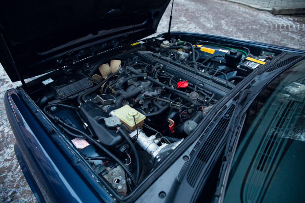 Open car hood showing detailed engine compartment
