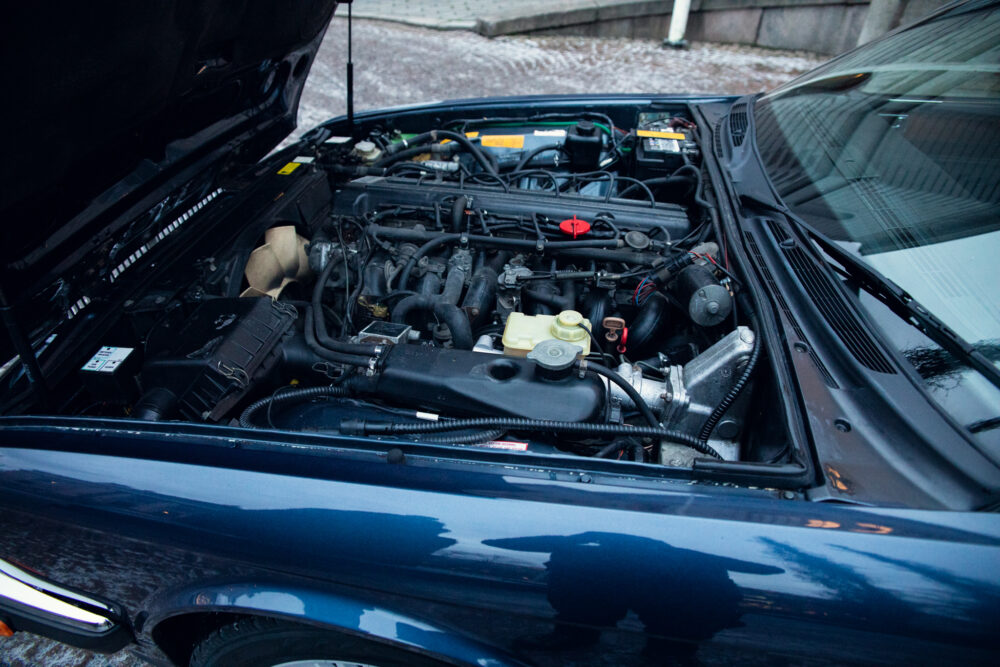 Detailed view of open car engine compartment
