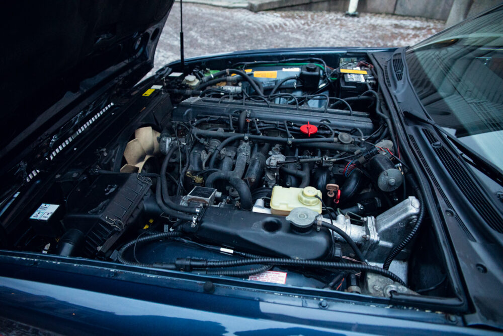 Detailed view of an open car engine compartment