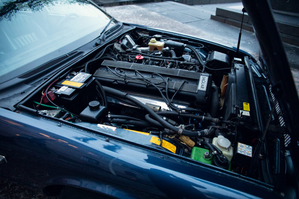 Open hood of a Jaguar showing detailed engine components