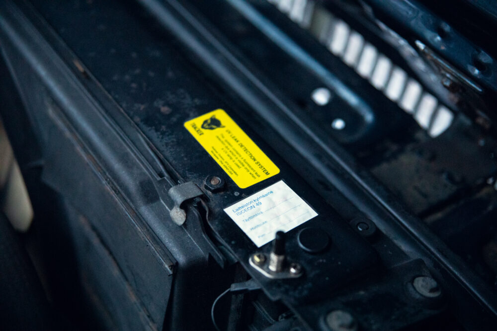 Warning label on industrial machine's metal frame