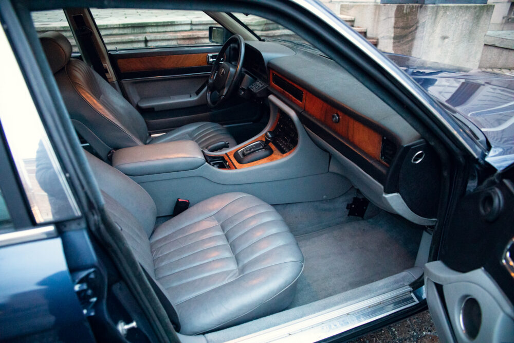 Luxury car interior with leather seats and wood trim