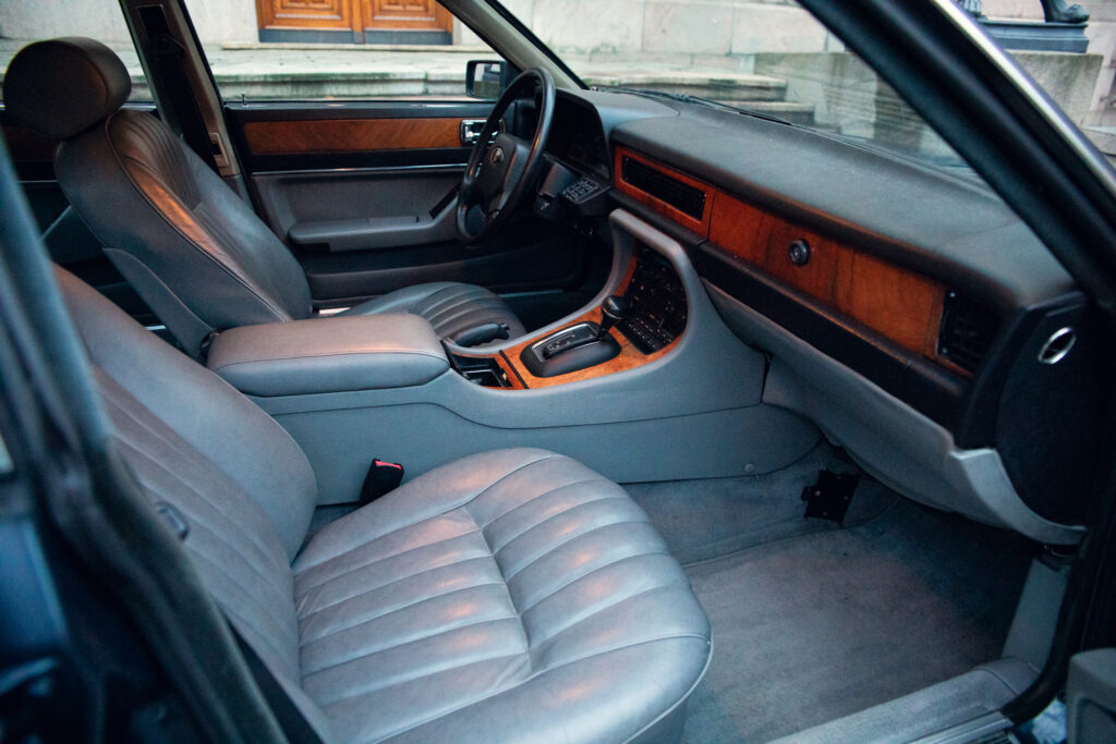 Vintage car interior with leather seats and wooden dash