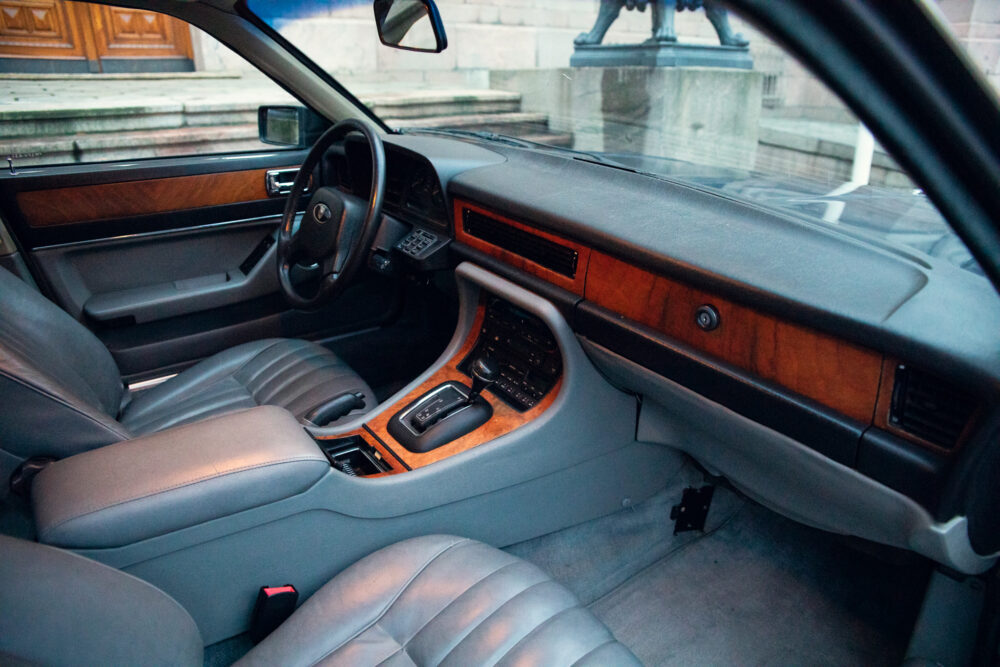 Luxury car interior with wood trim and leather seats