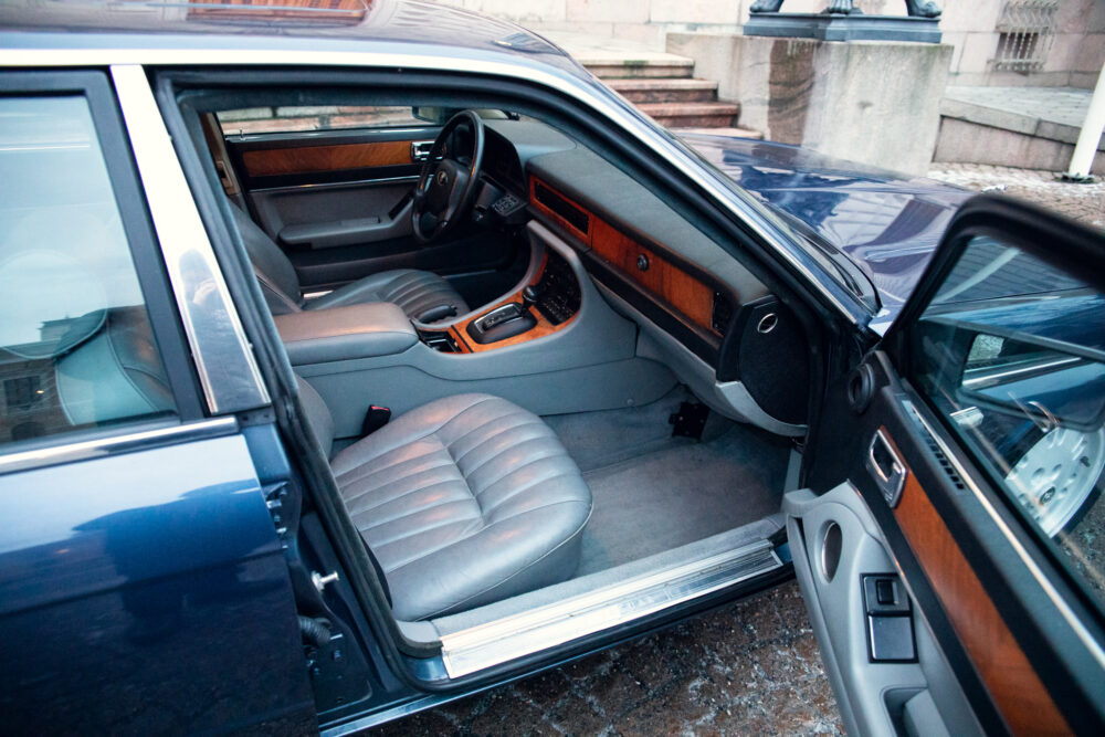 Luxury car interior with leather seats and wood trim