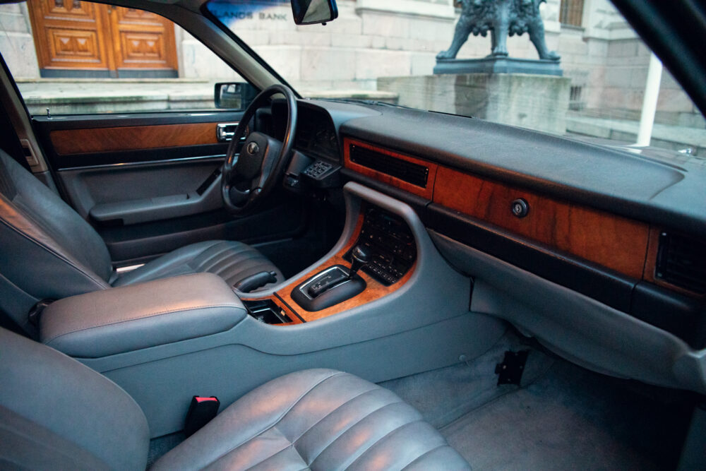 Vintage car interior with leather seats and wooden trim