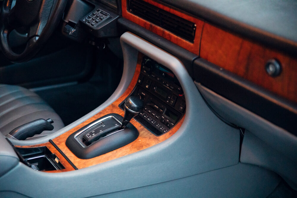 Vintage car interior with wood paneling and gear shift