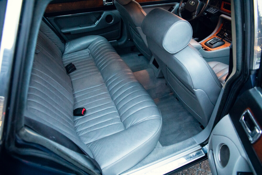 Luxury car interior with spacious gray leather seats