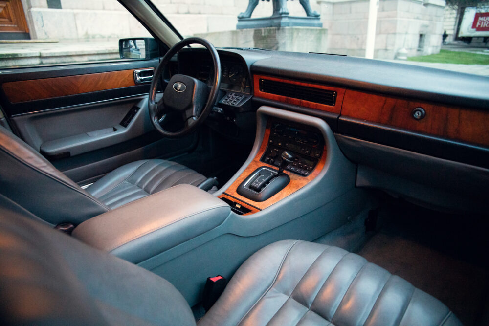 Vintage car interior with leather seats and wood paneling