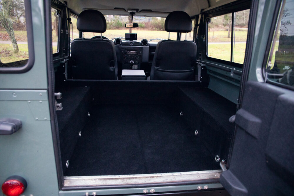 Interior view of an empty SUV trunk with seats