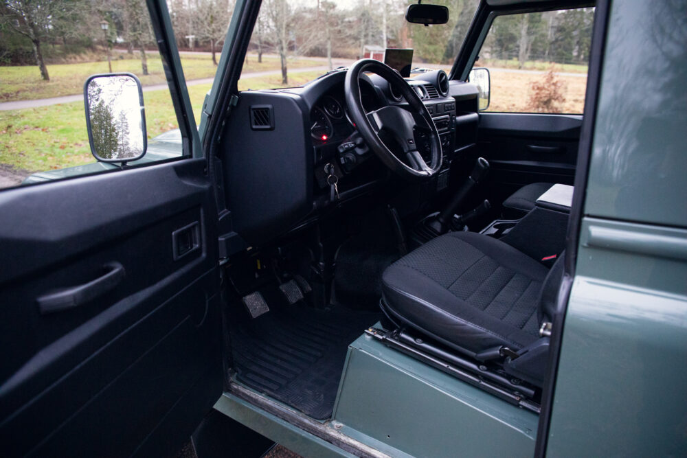 Interior view of a modern SUV with open door