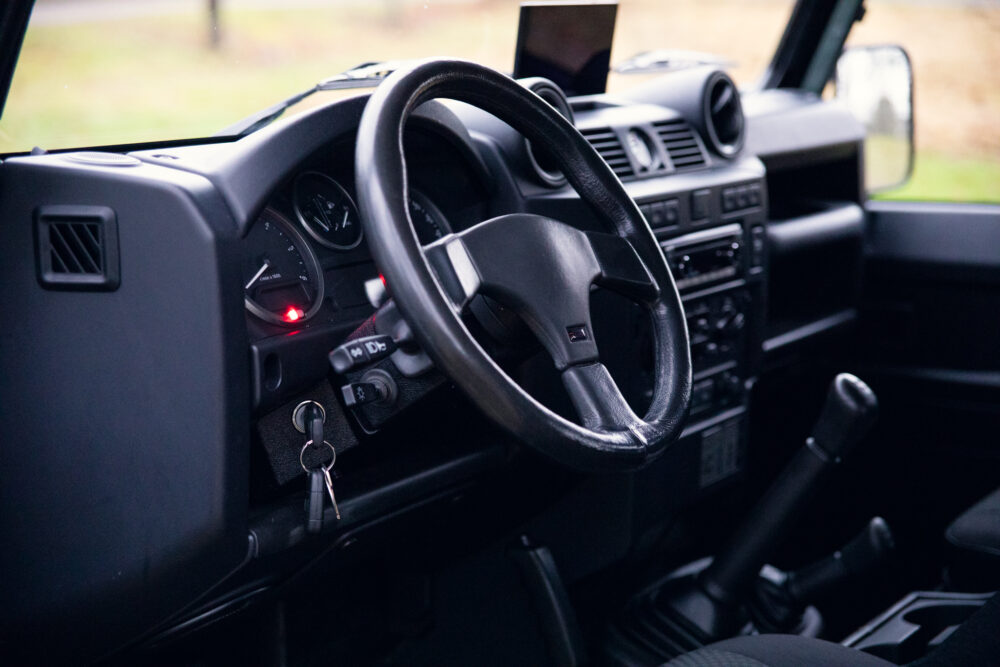 Interior of a modern vehicle with visible steering wheel