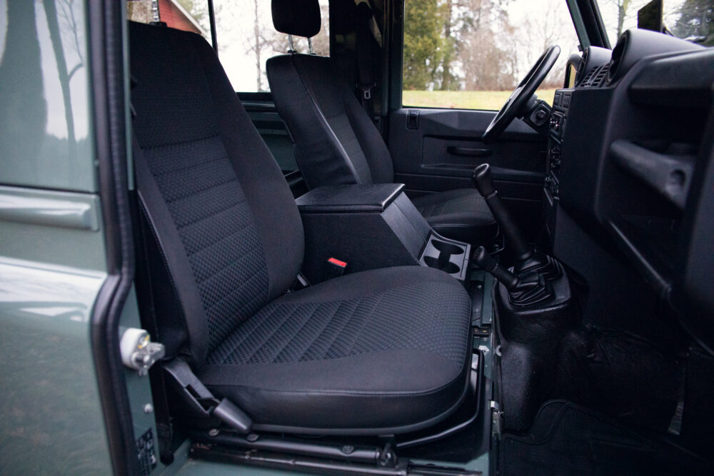 Interior view of SUV with manual transmission and seats