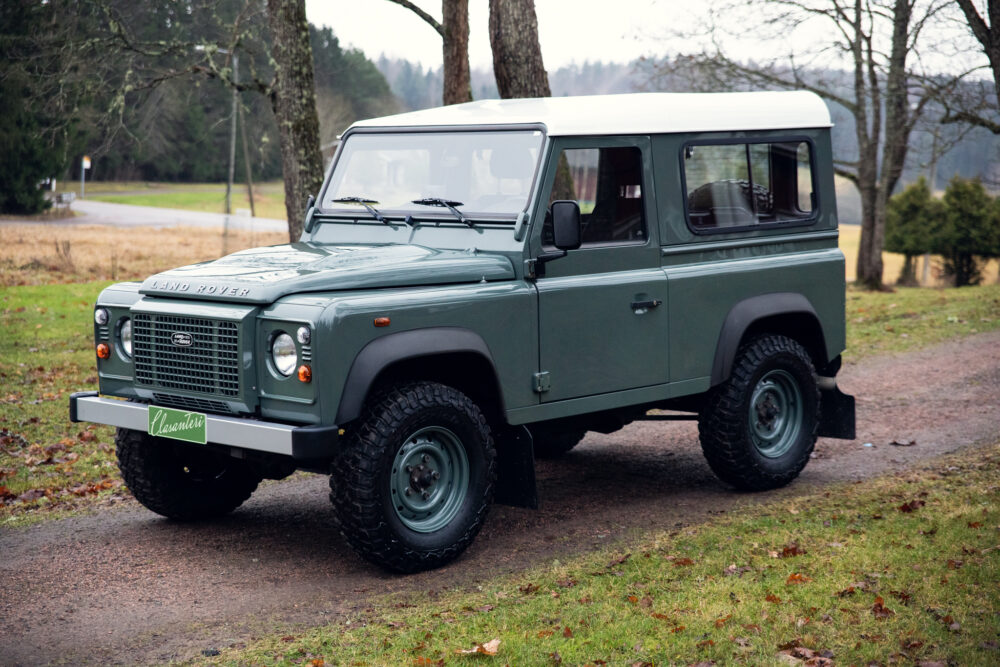 Green Land Rover Defender parked outdoors