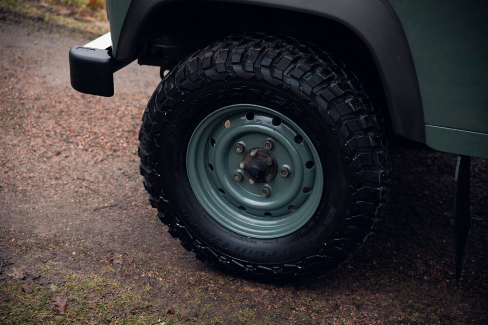 Close-up of off-road vehicle tire on dirt