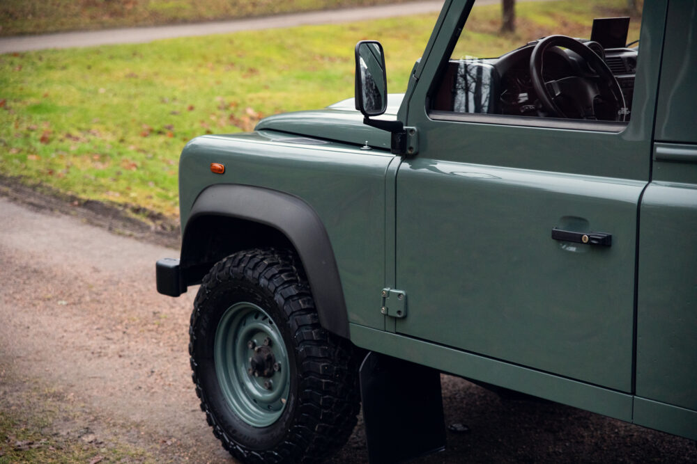 Green off-road vehicle parked outdoors