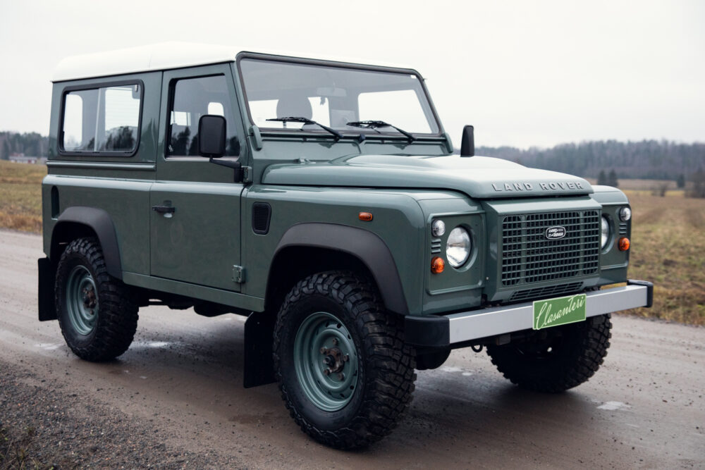 Green Land Rover Defender parked outdoors