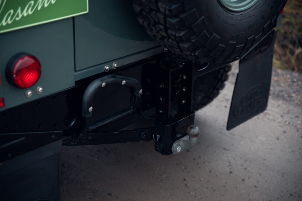 Close-up of trailer hitch on green vehicle