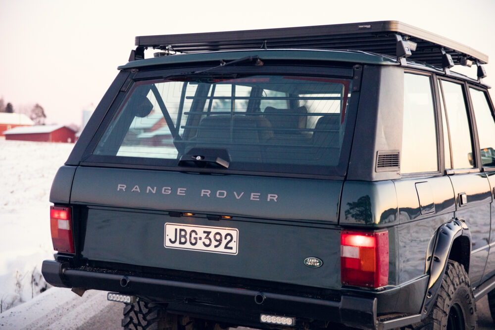 Range Rover in snowy landscape at dusk