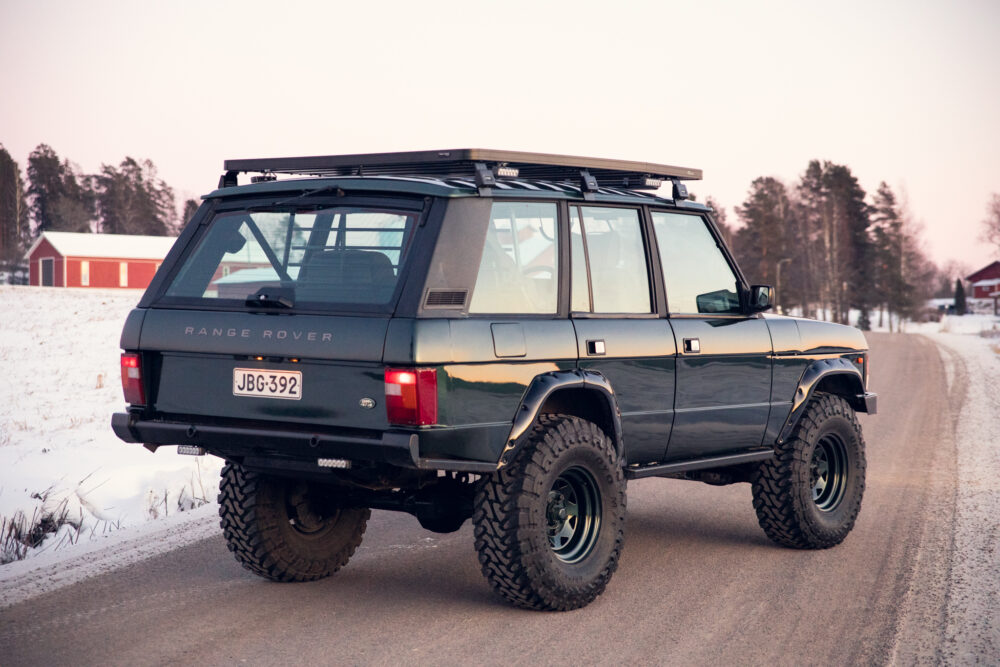 Modified Range Rover on snowy rural road