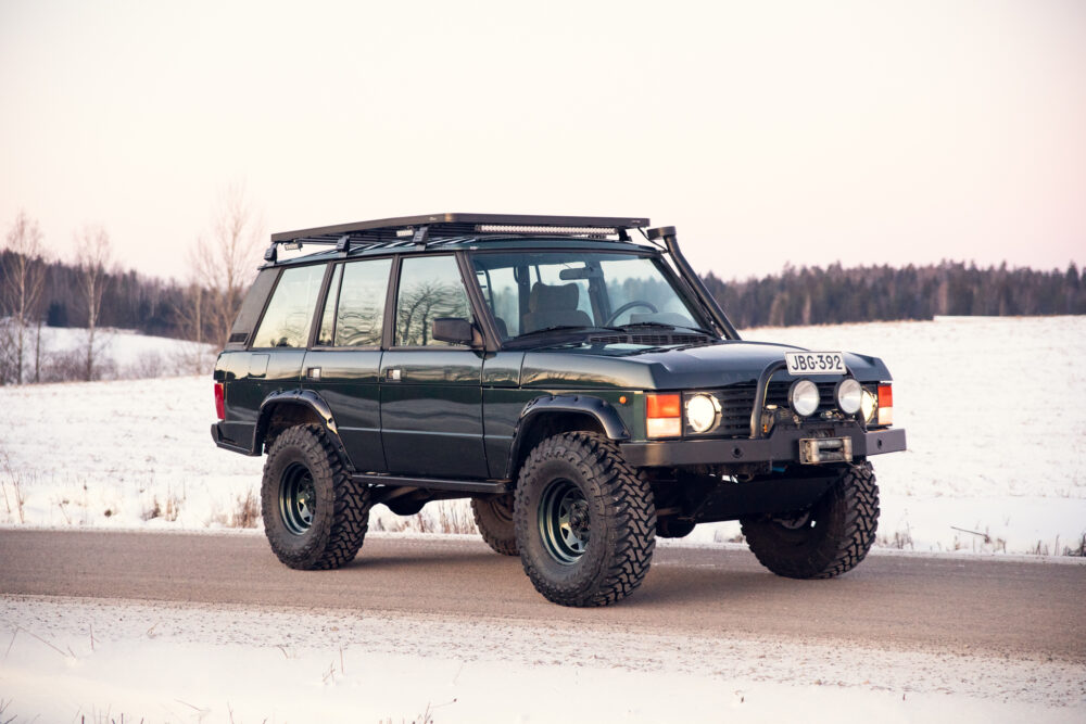 Black SUV on snowy road during winter