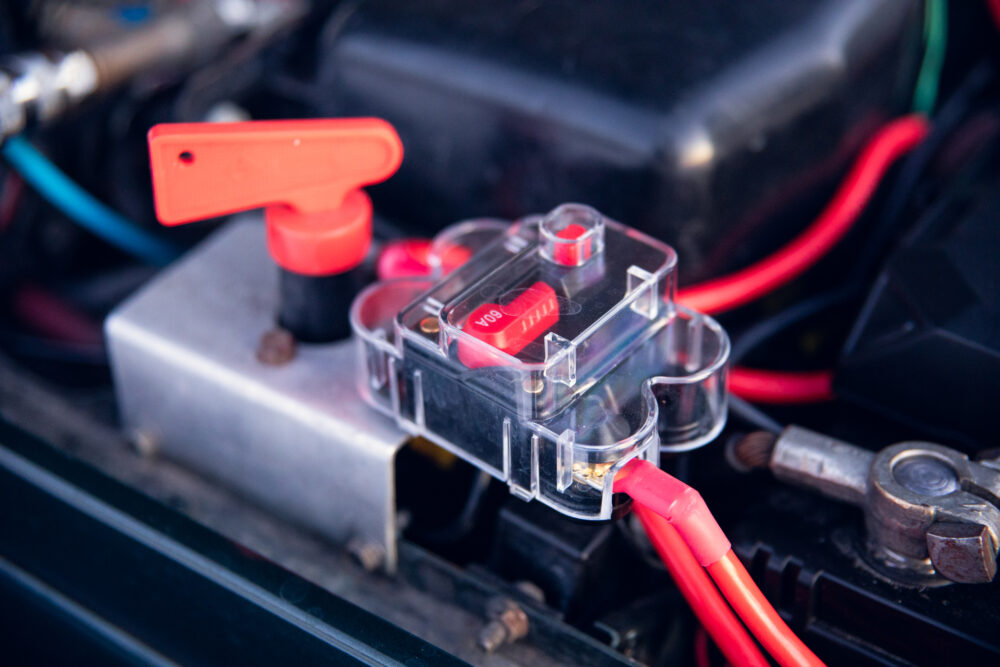 Detailed view of car battery terminals and connections