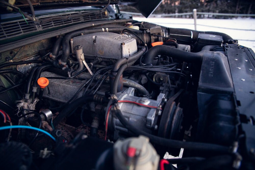 Detailed view of an open car engine compartment