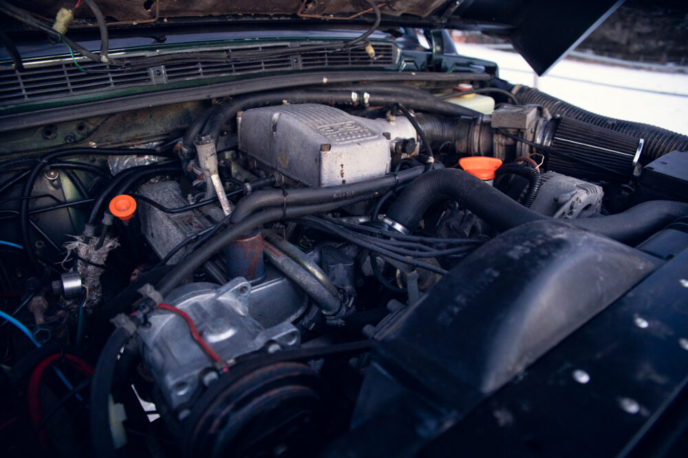 Detailed view of an open car engine compartment