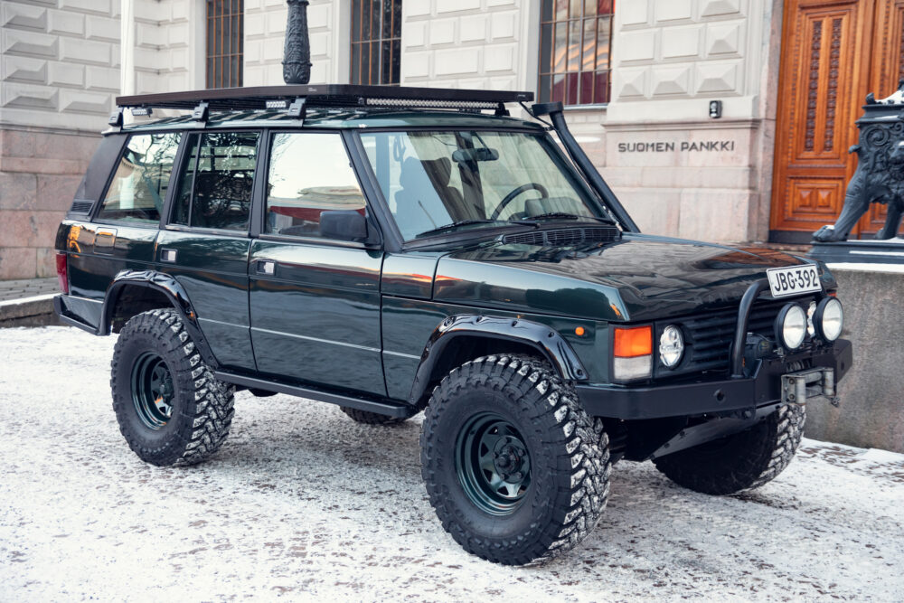 Black off-road SUV parked on snowy street