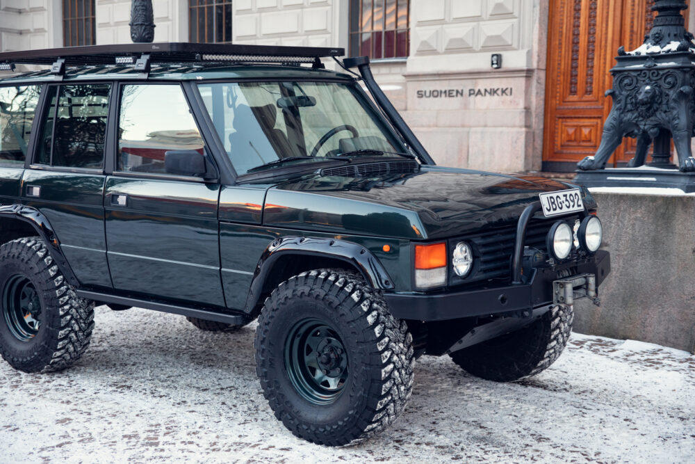 Black off-road vehicle parked in snowy setting