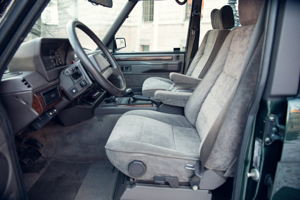 Interior of vintage car with gray fabric seats