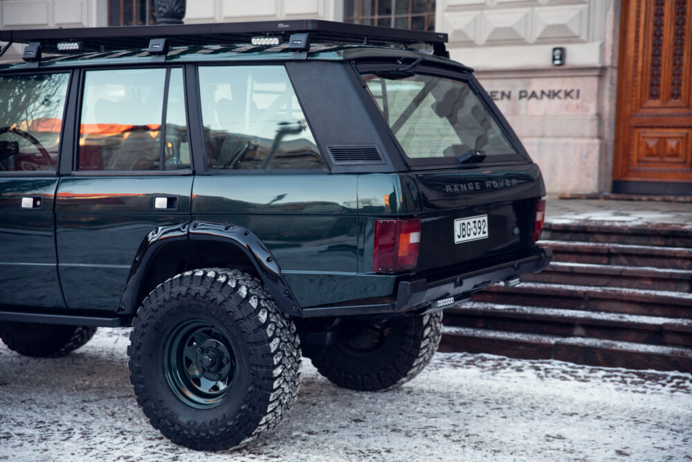 Vintage Range Rover parked on snowy street