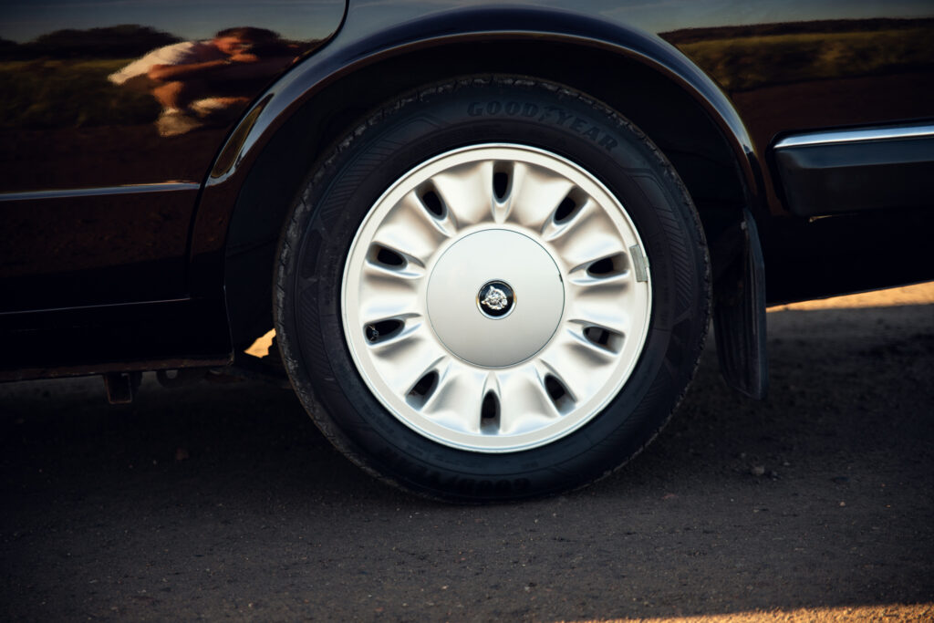 Close-up of car wheel and tire on pavement