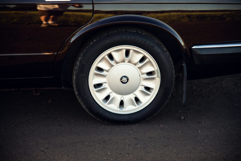 Close-up of car wheel with silver hubcap